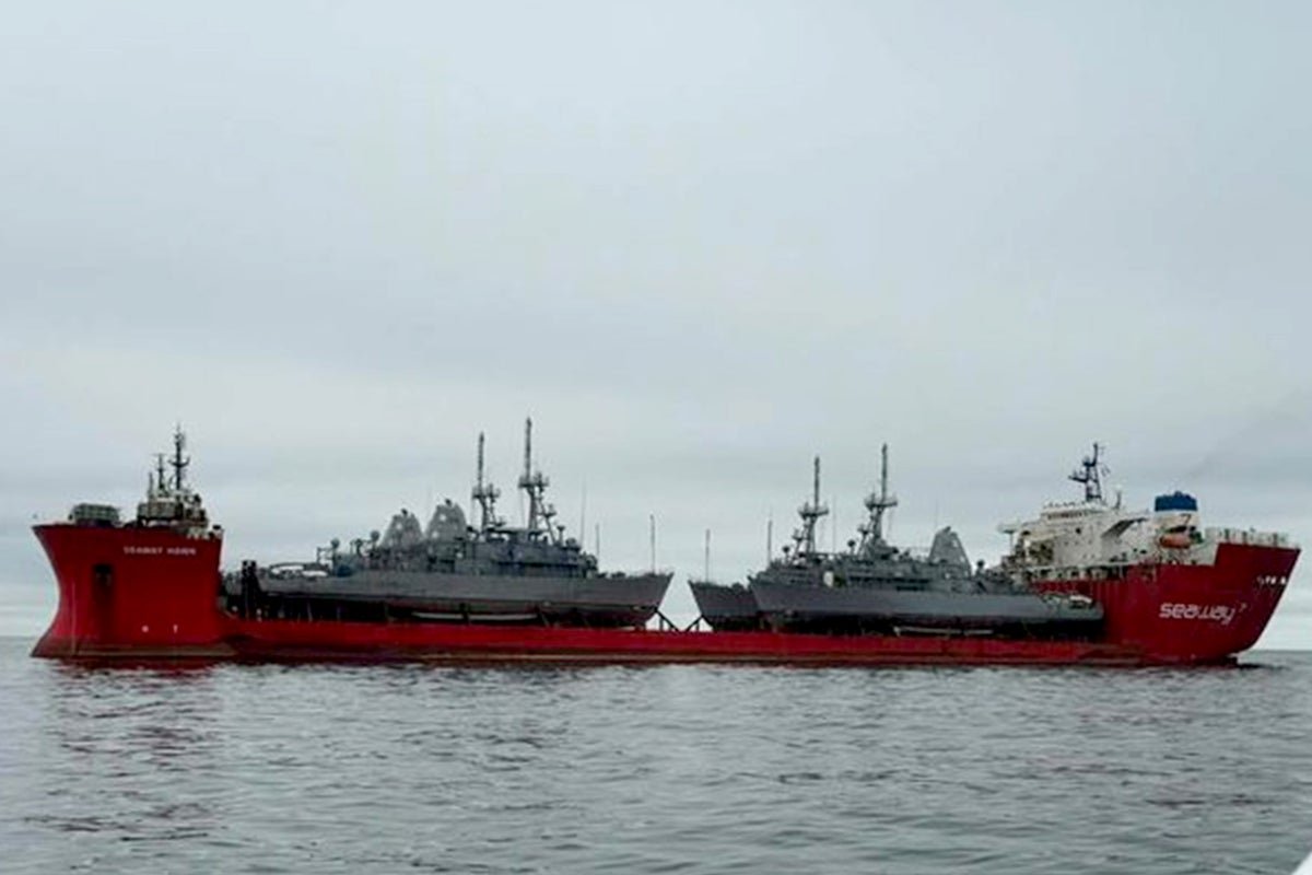 A US Navy mine-sweeper vessel in operation, highlighting the critical role these ships play in maintaining regional security and preventing the proliferation of naval threats in the Middle East, with the primary keyword phrase being mine-sweepers