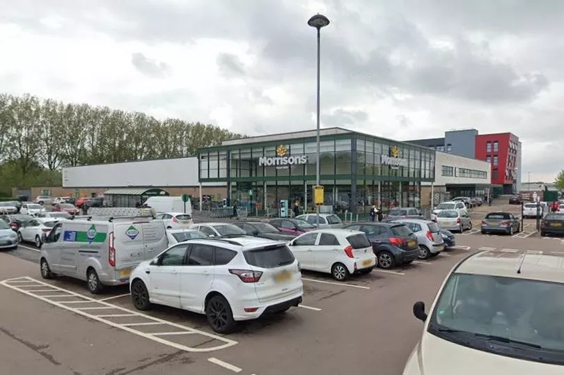 Morrisons supermarket store front with food hygiene offence notice
