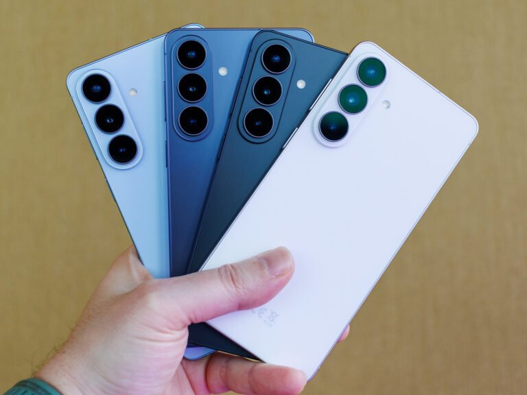 A person in a rural area using a Samsung Galaxy phone with satellite connectivity to access WhatsApp and other apps, with a scenic UK landscape in the background, showcasing the phone's ability to stay connected anywhere