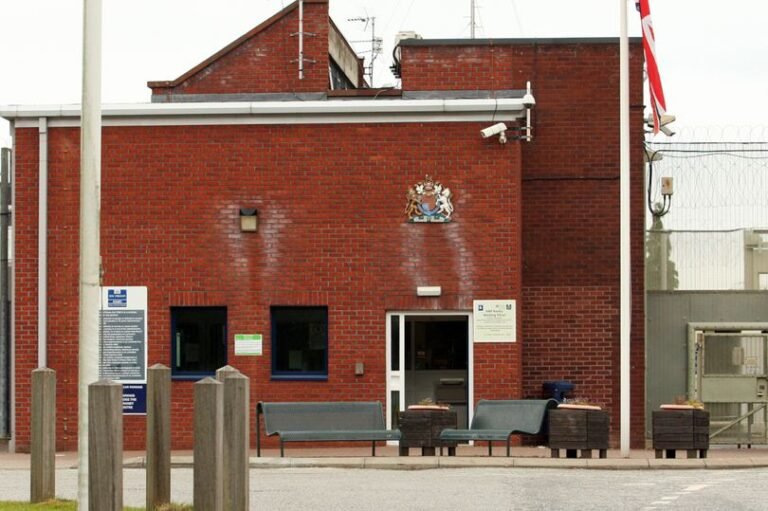 A prison officer stands guard outside a Nottinghamshire jail, where an inmate stabbed a officer in a horrific attack, highlighting concerns about prison safety and inmate behaviour