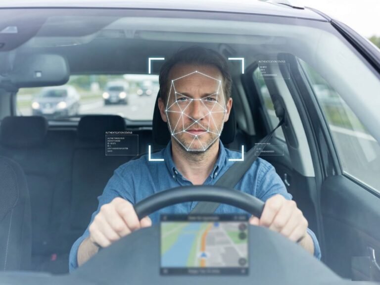 A close-up of a driver's face, with a facial AI system monitoring their expressions and behaviour, using advanced colour and contrast analysis to detect early warning signs of hazardous driving, such as drowsiness or aggression, in a UK-based vehicle