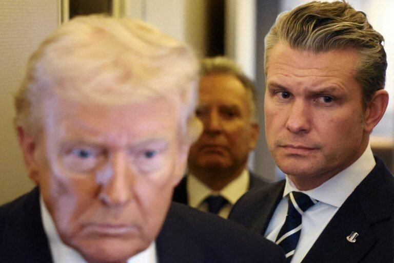 A dramatic image of the Iranian flag waving in the wind, with the US flag in the background, symbolising the Iran crisis and the complex relationship between the two countries, Iran crisis