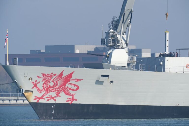 A British warship deployed to the Mediterranean to defend the Cyprus base, with a subtle hint of the UK's military presence in the region, highlighting the primary keyword phrase 'UK warship'