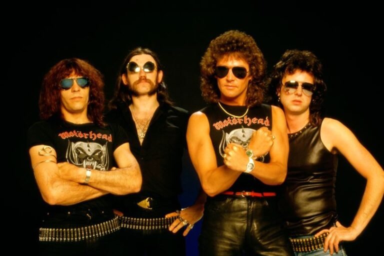 A photo of a Welsh rock musician performing on stage, with a crowd of fans in the background, highlighting the musician's passion and energy, with a focus on the Welsh rock music scene