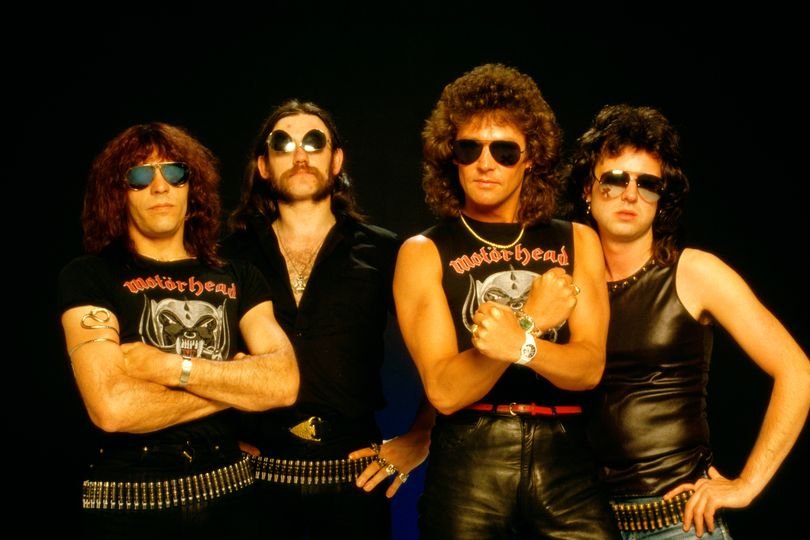 A photo of a Welsh rock musician performing on stage, with a crowd of fans in the background, highlighting the musician's passion and energy, with a focus on the Welsh rock music scene