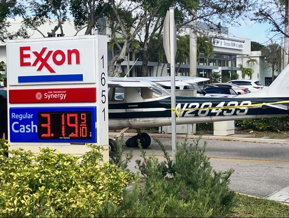 A small plane making an emergency landing on a Florida runway, with a crowd of people watching in the background, highlighting the bravery of the young pilot and the importance of pilot training and aviation safety