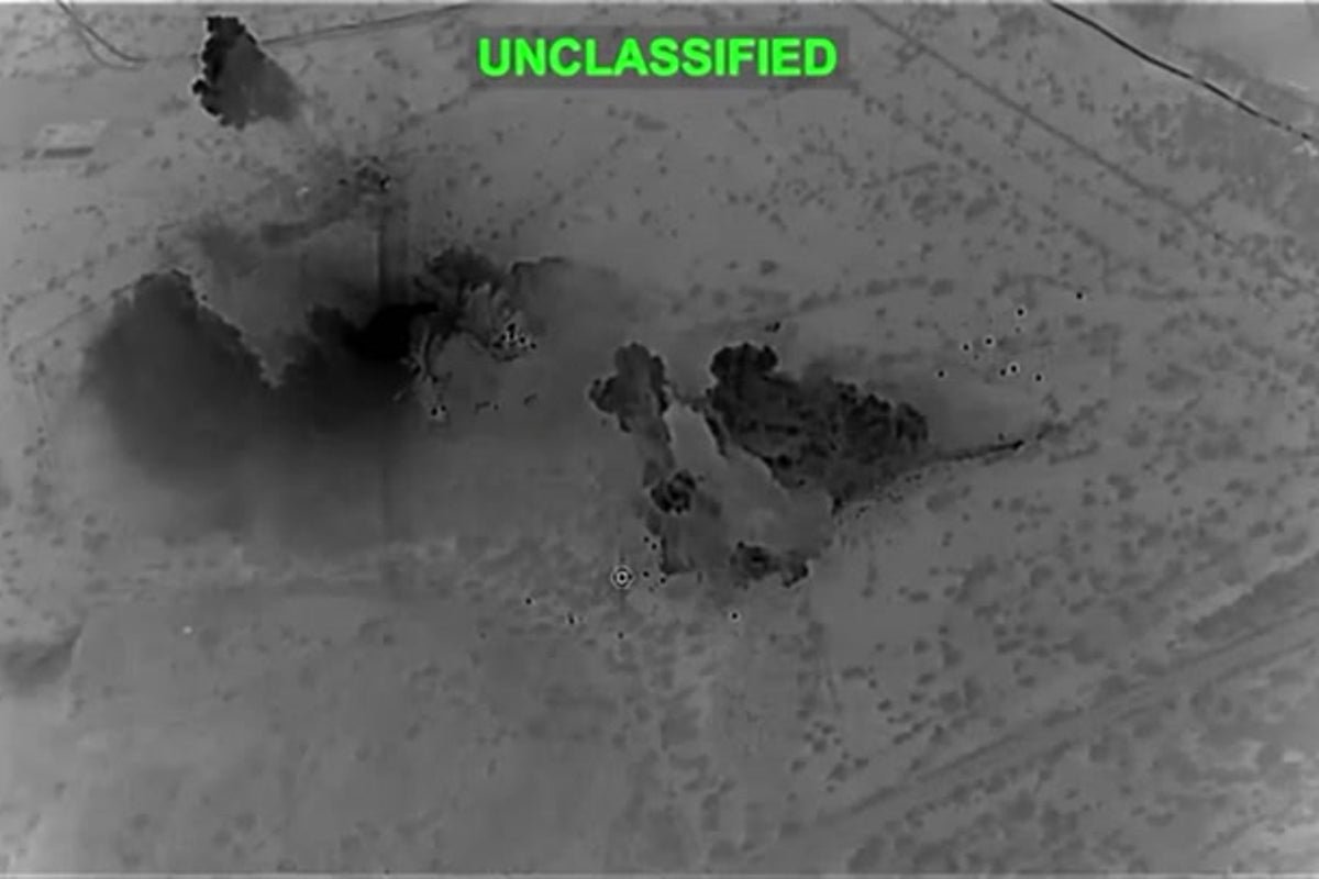 Aerial view of the Iranian oil facility, with smoke and flames billowing from the damaged structure, highlighting the devastating impact of the conflict on the environment and the economy, with the primary keyword Iranian oil facility