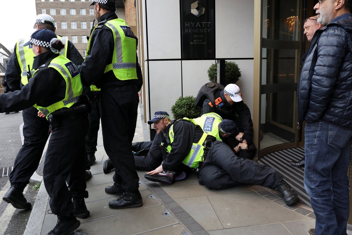 A crowd of protesters gathered in London for the al-Quds rally, holding signs and banners in support of the Palestinian people and against the Israeli Defence Forces, with a primary focus on the al-Quds rally