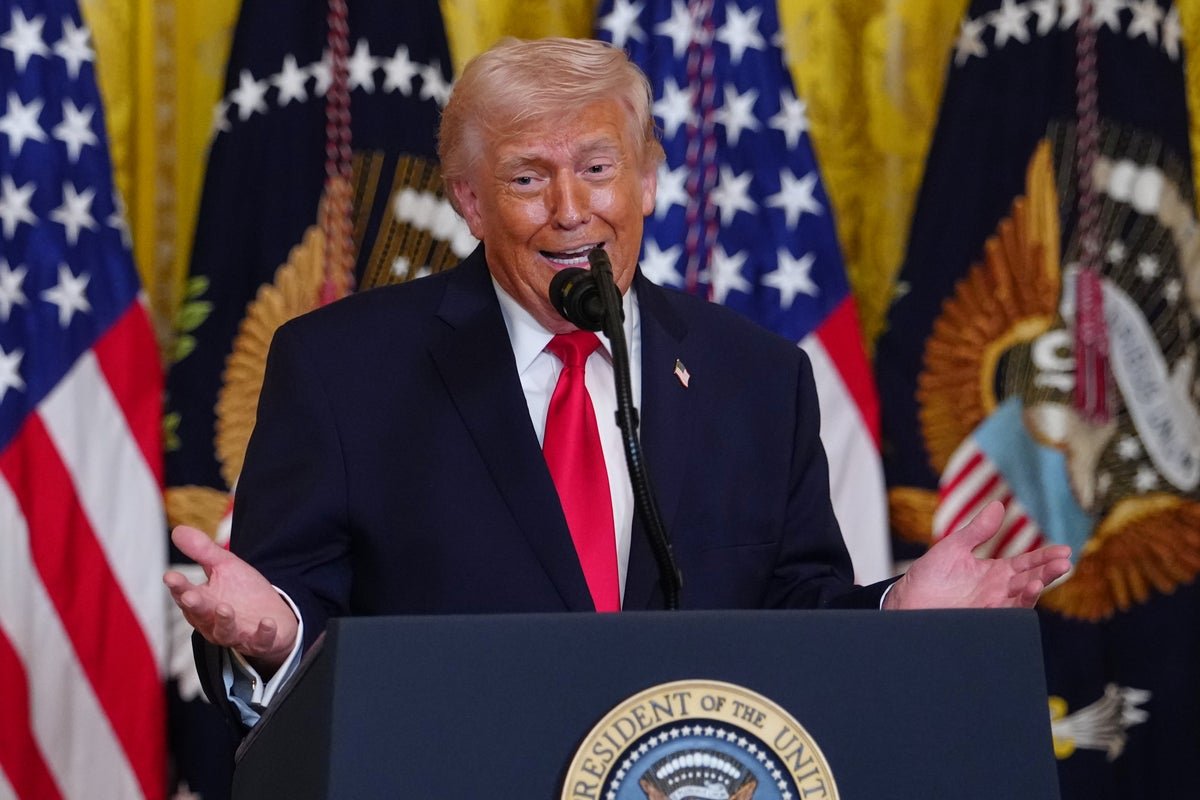 Aerial view of the Strait of Hormuz, with multiple ships passing through the critical waterway, highlighting the importance of maritime security in the region, as the US and its allies work to prevent a potential conflict with Iran