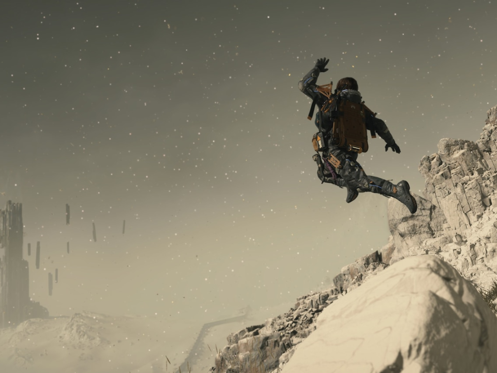 A screenshot of Death Stranding 2, showcasing its vibrant colour palette and intricate gameplay mechanics, with a focus on the game's protagonist navigating a treacherous landscape in the UK