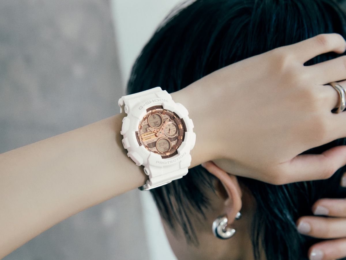 A close-up of the Casio G-Shock GMAS140PG-1A watch, featuring a metallic silver dial and black strap, with a precise stopwatch and 200m water resistance, perfect for outdoor activities in the UK