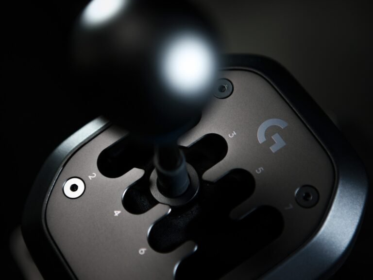 The Logitech G RS H-Shifter, a 7-speed manual gearbox with Hall-effect sensors, designed for sim racing enthusiasts in the UK, offering a realistic driving experience with smoother gear shifts and robust construction