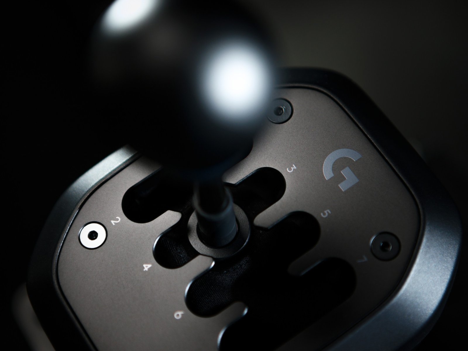 The Logitech G RS H-Shifter, a 7-speed manual gearbox with Hall-effect sensors, designed for sim racing enthusiasts in the UK, offering a realistic driving experience with smoother gear shifts and robust construction