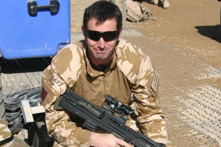 A disgraced ex-soldier who was stripped of his MBE honour due to his involvement in a school fees fraud scandal, highlighting the need for transparency and accountability in the honours system, with a focus on the importance of analysing an individual's character and behaviour before bestowing such a prestigious honour