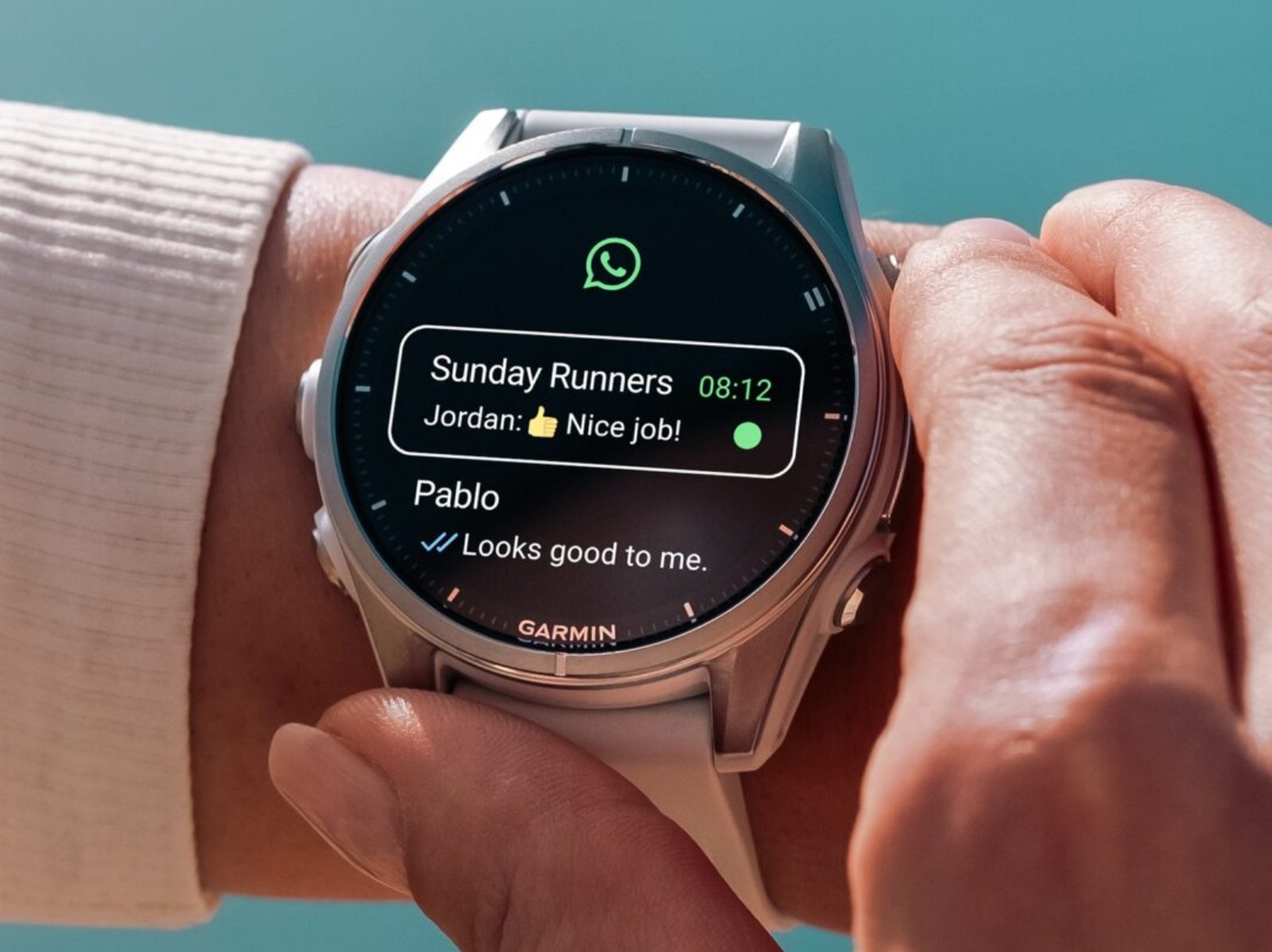 A Garmin smartwatch with WhatsApp open on the screen, demonstrating the new feature and its benefits for users in the UK, with a colourful and modern design