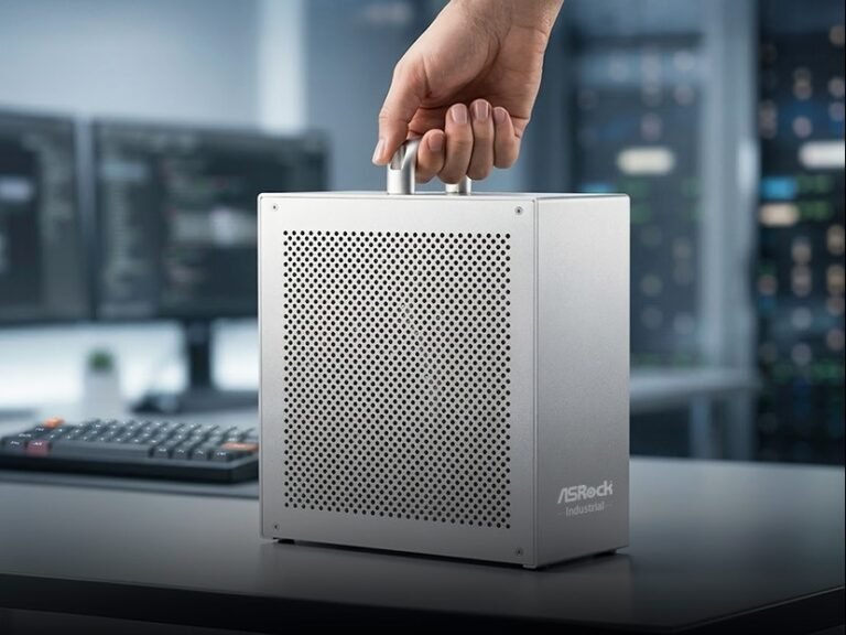 The ASRock AI BOX-A395 mini workstation PC features a stylish aluminium case and handle, with a powerful AMD Ryzen AI Max+ 395 APU and up to 128 GB LPDDR5X-8000 RAM, making it perfect for professionals working with AI and machine learning in the UK, with a sleek colour scheme and compact design