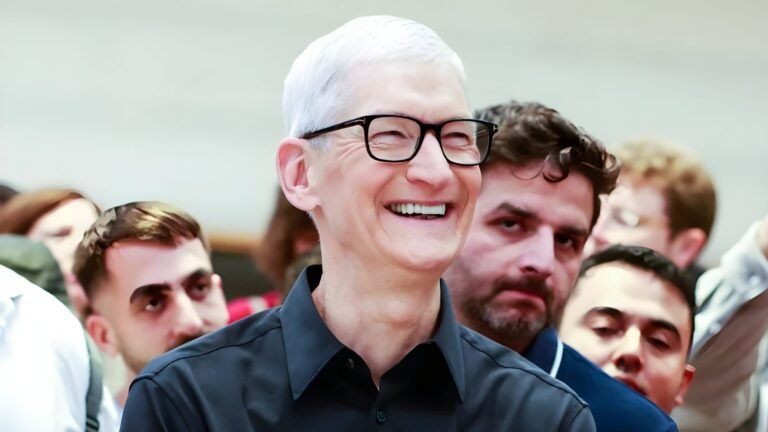 Tim Cook, Apple's CEO, speaking at a conference in the UK, with a confident expression, highlighting his love for the company and its mission, as the primary keyword is Apple CEO