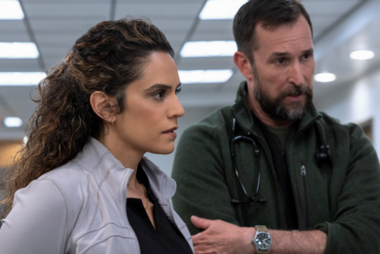 Noah Wyle on set, discussing The Pitt's most brilliant decision with the crew, highlighting the importance of collaboration and innovative storytelling in the creative industry