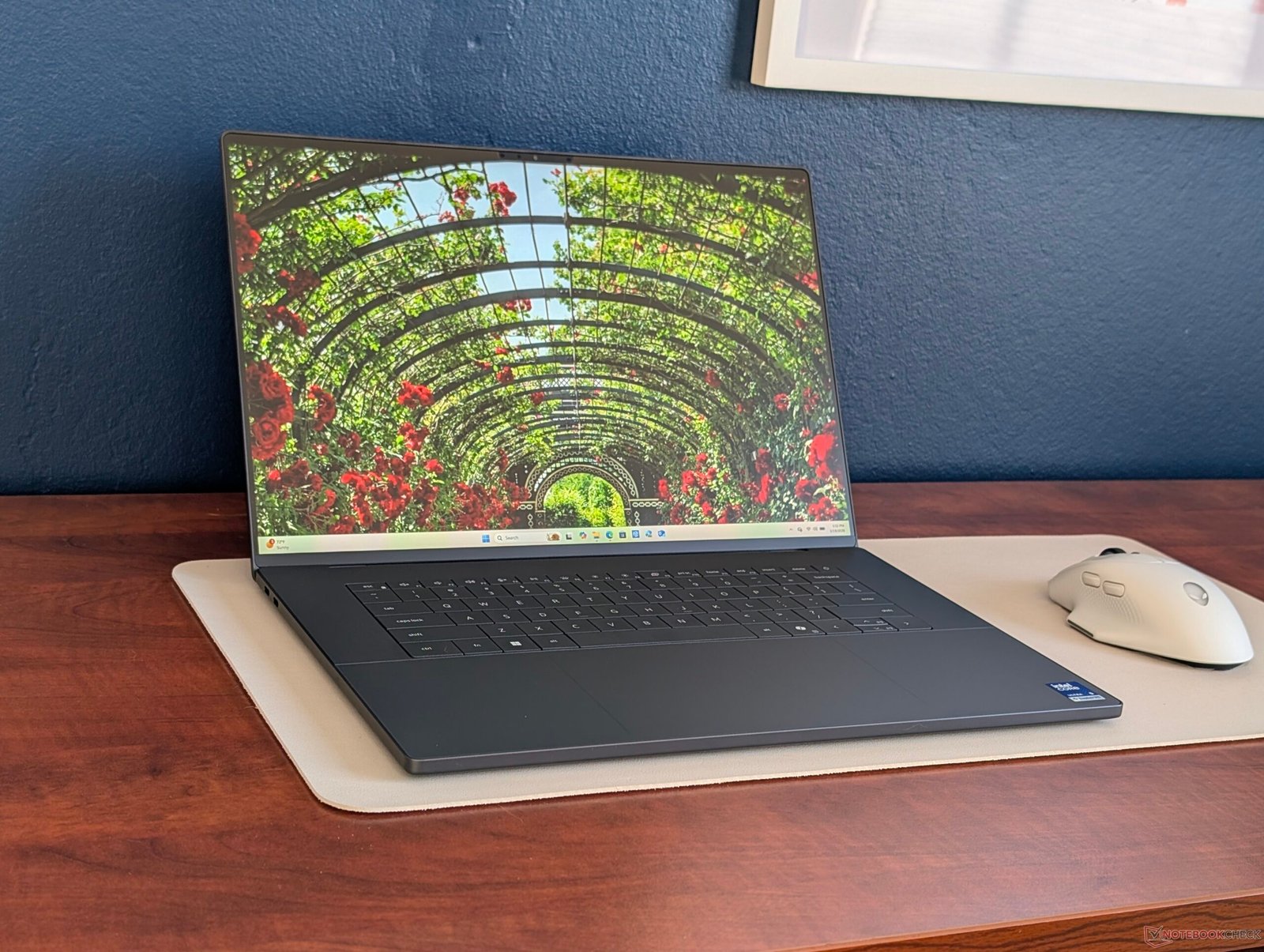 The Panther Lake XPS 16 laptop shown in a natural setting, highlighting its sleek design and minimal power consumption, with a focus on its long battery life as a primary keyword, making it an ideal choice for those seeking efficient laptops in the UK, with its colour and design appealing to a wide range of users