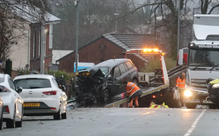UK taxi crash scene with emergency services