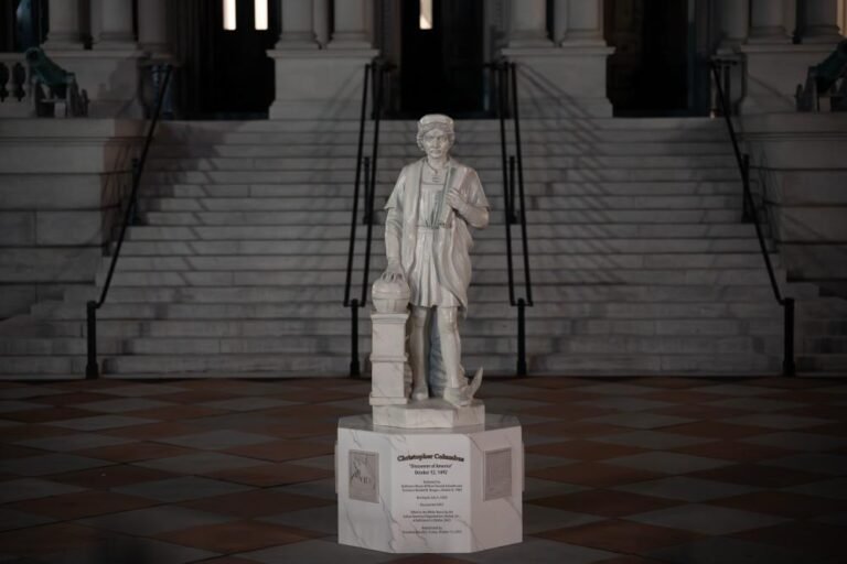 A photo of the newly erected Christopher Columbus statue in the White House grounds, sparking controversy and debate about the explorer's legacy and its impact on indigenous peoples