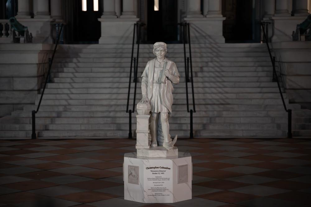 A photo of the newly erected Christopher Columbus statue in the White House grounds, sparking controversy and debate about the explorer's legacy and its impact on indigenous peoples