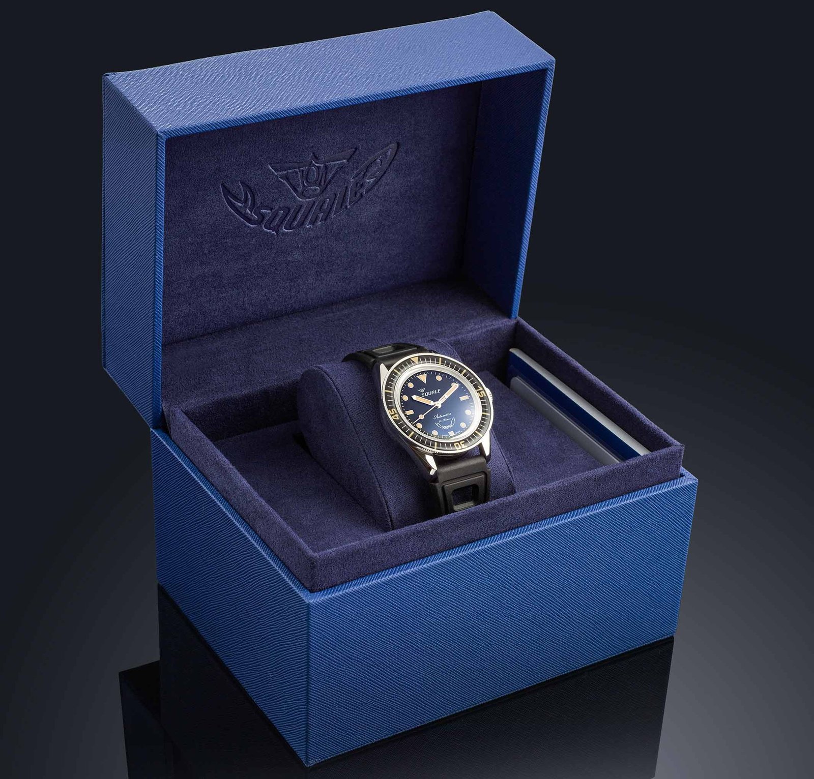 The Squale Sub-37 Legend dive watch features a 37 mm stainless steel case, unidirectional bezel, and rubber strap, with a simple yet clean dial design, making it a great choice for divers in the UK with its 30-bar water resistance