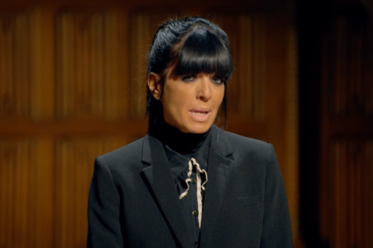 A group of celebrities standing together, looking suspicious and unsure of who to trust, with a hint of tension and drama in the air, as they prepare to participate in the Celebrity Traitors 2026 show, with a colourful and dramatic background