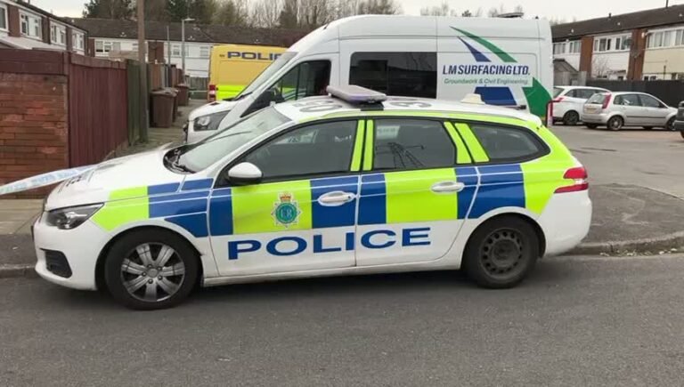 A cordon around Bowland Drive in Litherland, with police tape and officials present, highlighting the ongoing investigation and public safety measures in place, amidst the Litherland incident