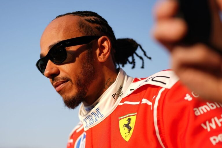 Lewis Hamilton in his F1 car, with a determined look on his face, amidst a Christmas Day backdrop, symbolising his bold decision that will impact the F1 season