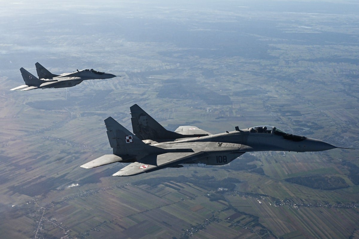 Aerial view of fighter jets scrambled by Poland in response to Russia's drone and missile attack on Ukraine, highlighting the escalating conflict in Eastern Europe