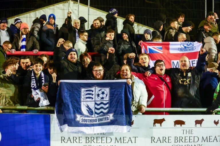 Southend United fans celebrate victory at Braintree Town football ground
