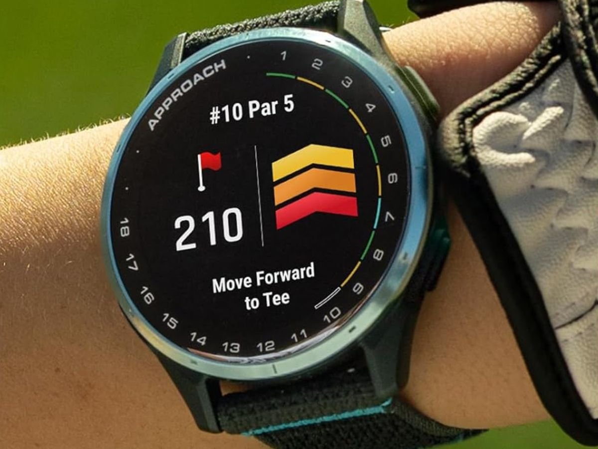 A Garmin smartwatch user in the UK navigating with the new navigation page tool, featuring a colour display and intuitive interface, with the UK countryside in the background