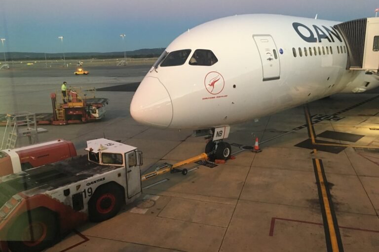 The Eiffel Tower in Paris, a potential new gateway to Australia for British travellers, with a plane flying in the background, symbolising the new travel route