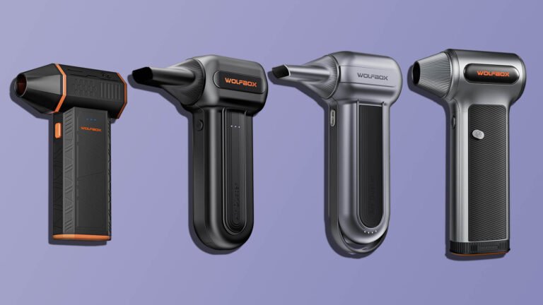 A person holding a WOLFBOX portable air blower, with a background of a workshop in the UK. The blower is black and red in colour, with a robust design that can withstand rough handling. The image showcases the product's features and benefits, including its ease of use and powerful performance. With a WOLFBOX portable air blower, you can enjoy a reliable and efficient blowing experience, perfect for various tasks and applications.