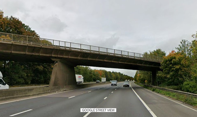 A car lies wrecked after falling off a bridge and crashing into a minibus on the M1 motorway, with emergency services attending the scene of the fatal accident, which has raised concerns about road safety and the behaviour of teenage drivers