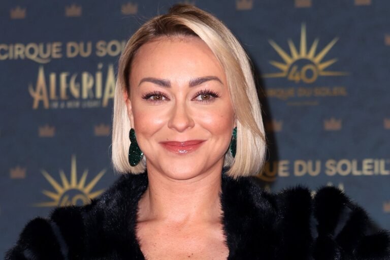 Luba Mushtuk, a professional dancer, poses with her dance partner, showcasing her impressive skills and charming personality, as she announces her departure from Strictly Come Dancing after a decade, amidst an ongoing cast cull, leaving fans to analyse her legacy and the impact of her exit on the programme