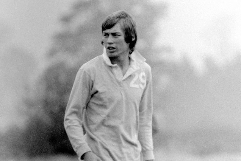 A photo of the Hibs legend in action on the pitch, surrounded by fans and fellow players, with a colourful backdrop of the Edinburgh stadium, highlighting the individual's impressive skills and dedication to the sport, as the primary keyword, Hibs legend, is honoured