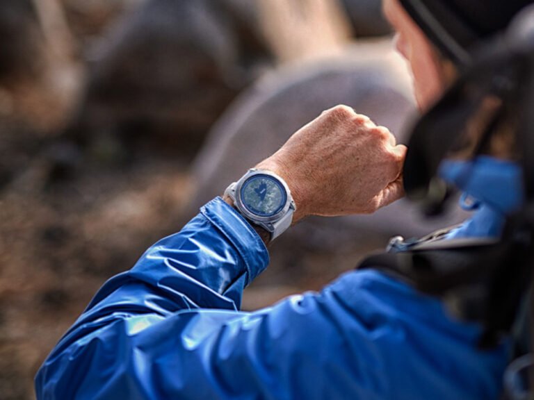 A Garmin smartwatch with inReach Remote functionality, displaying a map of the UK on its colour screen, allowing users to stay connected and navigate with ease, making it an essential tool for outdoor enthusiasts and adventurers in the UK