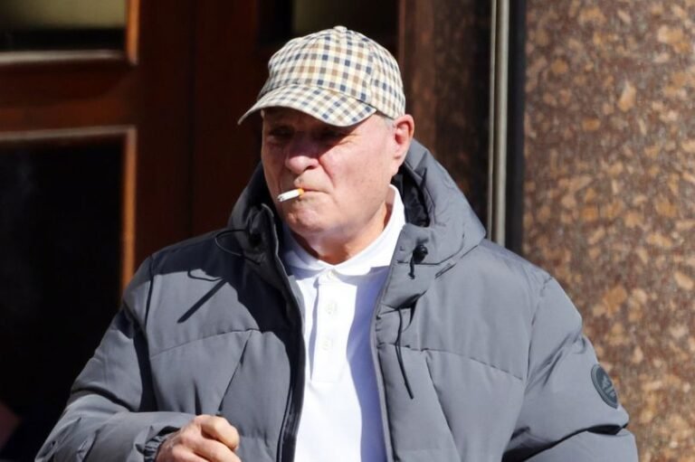 A person feeling disturbed and vulnerable due to stalking behaviour, with a blurred background to represent the invasion of privacy, highlighting the importance of respecting boundaries and taking action against harassment