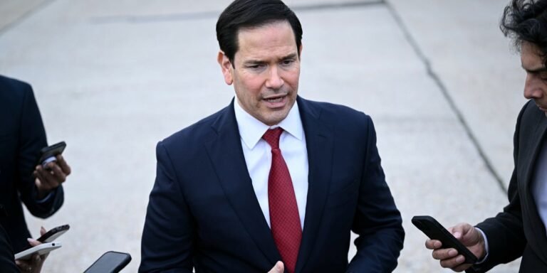 Marco Rubio speaking at a press conference, trying to explain Trump's Ukraine policy, with a confused expression on his face, surrounded by reporters and cameras, highlighting the complexity and controversy of the issue