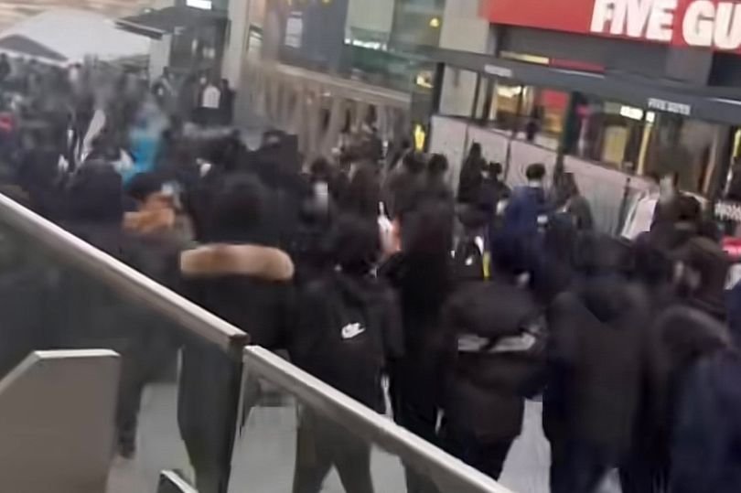 Schoolchildren running riot near the Bullring shopping centre in Birmingham, causing chaos and disruption, with shoppers looking on in terror, highlighting the need for increased security measures in the area, particularly during peak hours, near the popular shopping destination