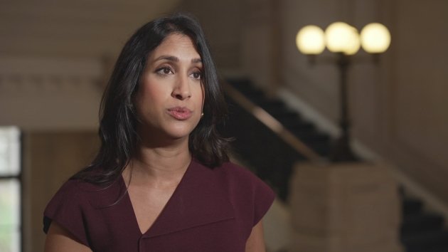 A photo of Badenoch speaking in parliament, with a caption that reads 'Badenoch speaks out against Trump, sparking a heated debate about politics and principle in the UK, with the Conservative party defending her actions and sparking a wider conversation about the state of politics in the UK'