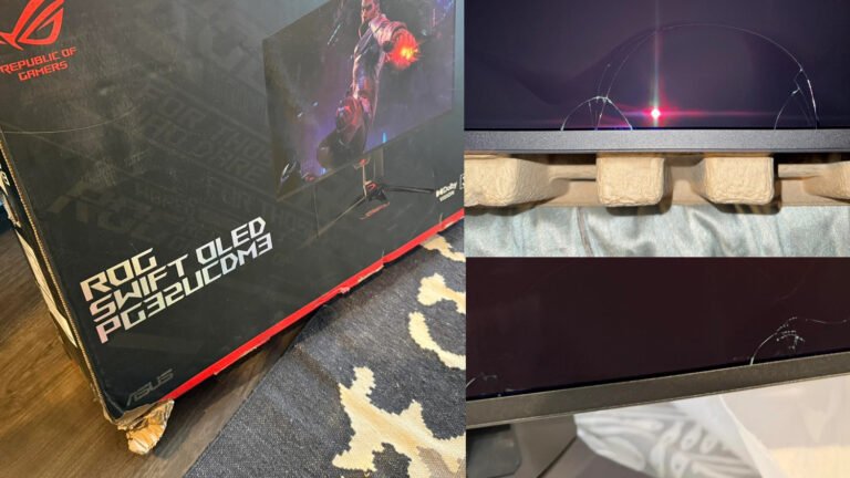A damaged ASUS PG32UCDM3 QD-OLED 4K monitor with a cracked screen, highlighting the need for proper packaging to prevent such damage during shipping in the UK, with a focus on the QD-OLED technology