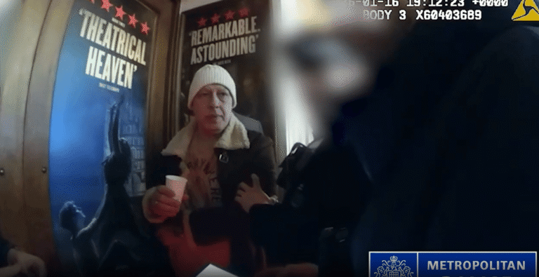 A descriptive image of a person being arrested by the Met Police, with a focus on the primary keyword upskirting, in the context of the Soho incident, where 20 victims were targeted in one night, with the perpetrator being caught and brought to justice