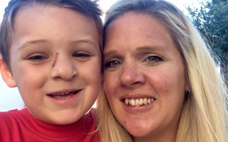 mother holding a photo of her son