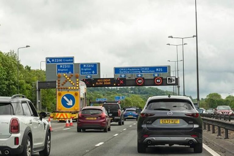 A photo of a driving licence with a reminder to update details, including name and address, to avoid fines and ensure road safety, as warned by the DVLA, with a focus on driving licence updates and road safety