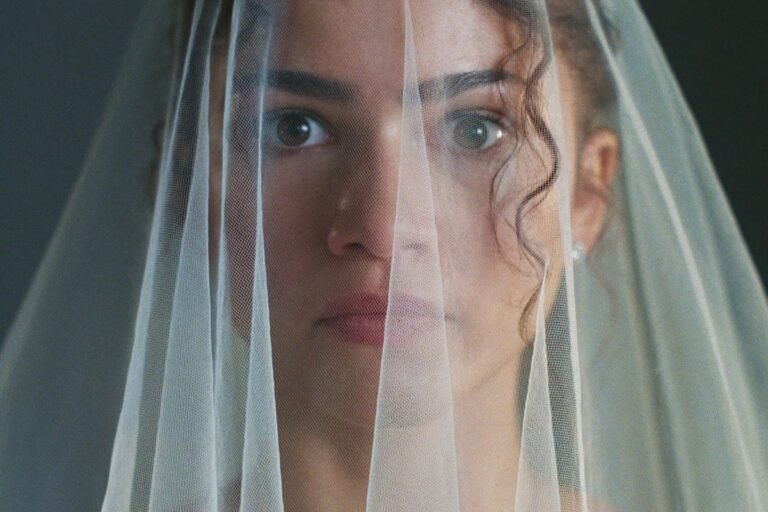 Zendaya posing on the red carpet, looking stunning in a beautiful colour block dress, showcasing her unique sense of style and charisma, with a bright smile and confident behaviour, embodying the essence of a talented and inspiring actress