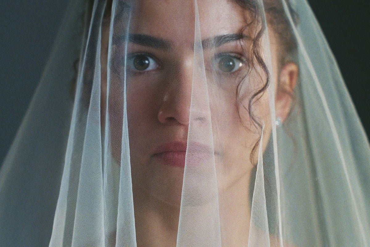 Zendaya posing on the red carpet, looking stunning in a beautiful colour block dress, showcasing her unique sense of style and charisma, with a bright smile and confident behaviour, embodying the essence of a talented and inspiring actress