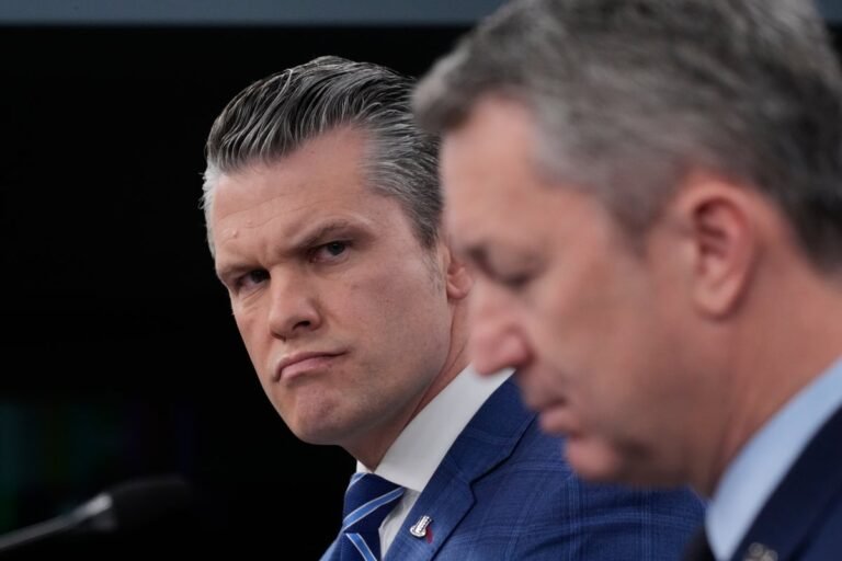 A photo of Pete Hegseth speaking at a press briefing, with a caption describing the Iran ceasefire and its significance in global politics, as the international community watches closely, analysing the behaviour of key players and the colour of the situation